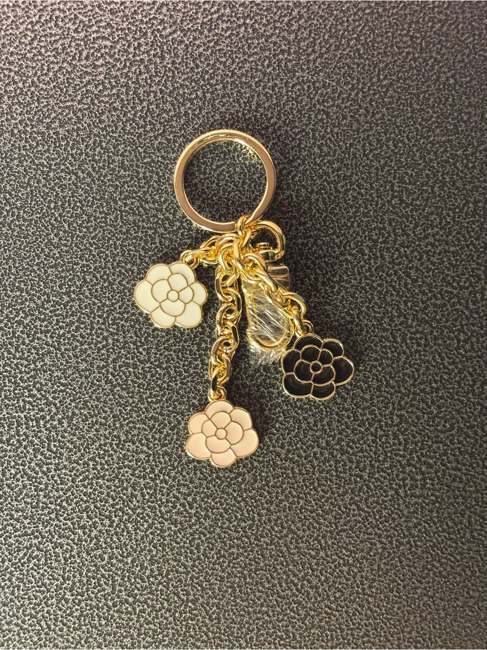 Gold Flower Charm Keyring with Pink, White, and Black Accents